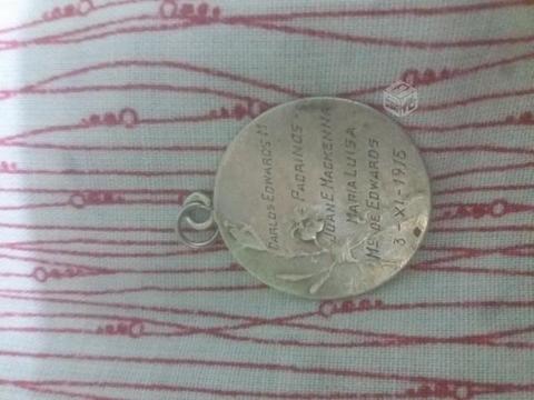 Medalla bautizo carlos edwards..1915